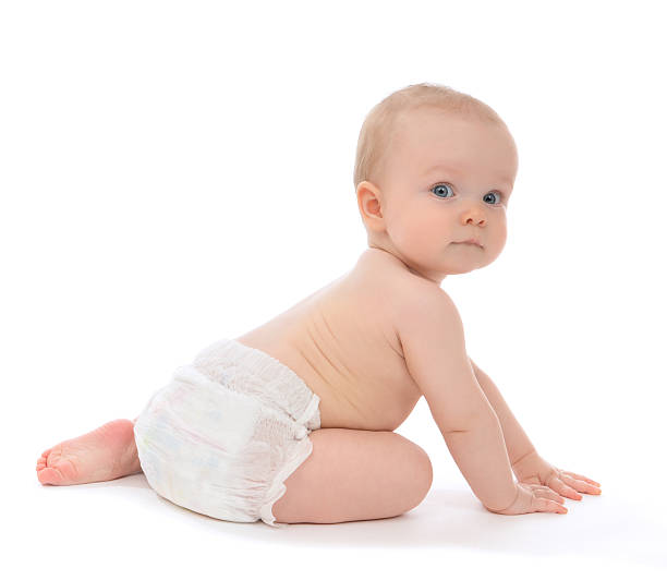 Infant child baby toddler sitting crawling backwards Infant child baby toddler sitting crawling backwards happy smiling on a white background back to front stock pictures, royalty-free photos & images