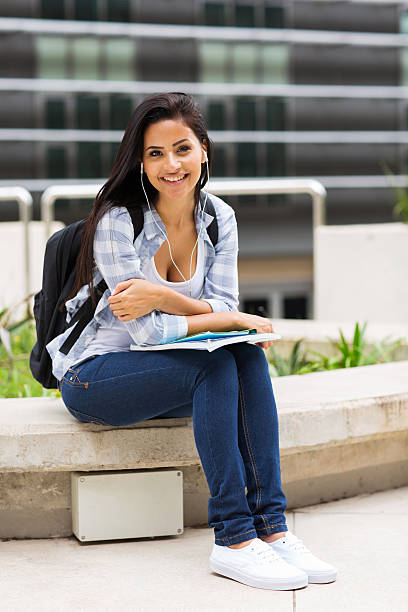 istock young college student sitting outside campus building 510126949
