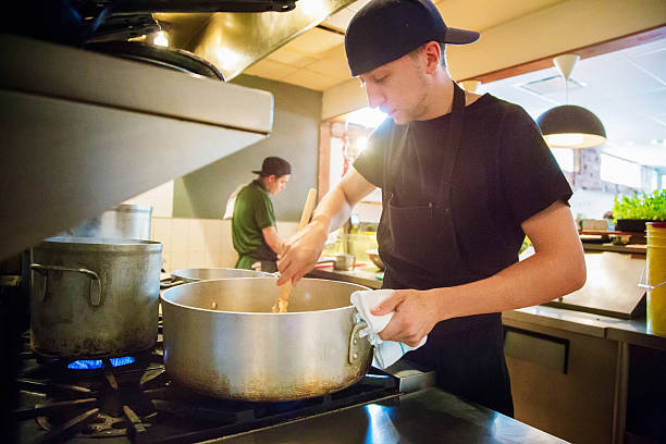 istock Cooks in a small restaurant preparing for service 510130907