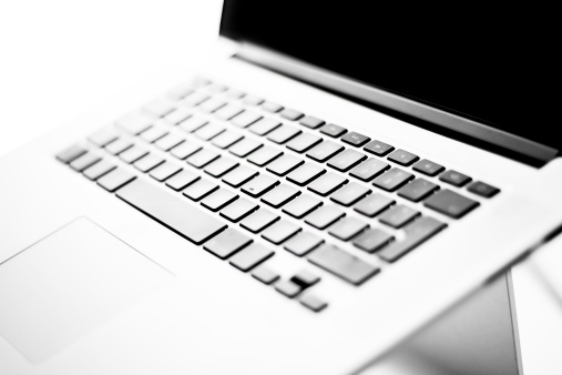 Germany, Berlin - 2.September, 2014: Front view of a MacBook Pro laptop computer by Apple Inc. on a white background.