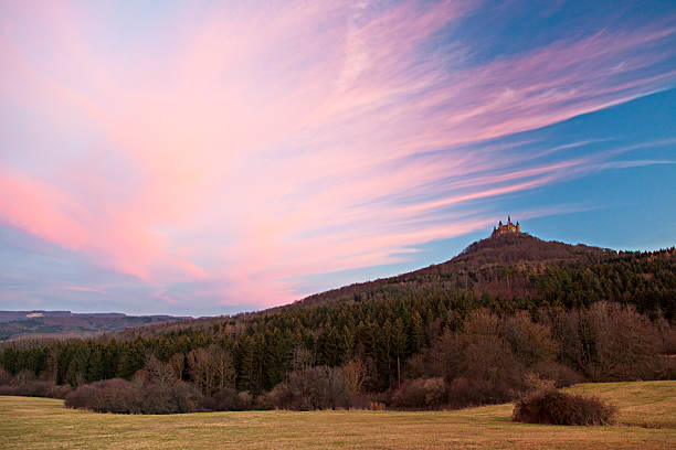 Bisingen, Germany - December 13, 2015: Faraway Hohenzollern castle in sunset with pink clouds
