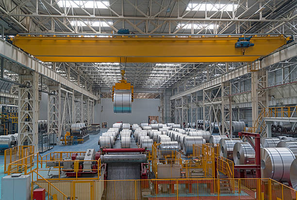 Overhead crane in aluminum factory carrying large aluminum steel rolls. This pictures were taken in Asas Aluminum Factory in Adapazari Turkey with a special permission together with property release