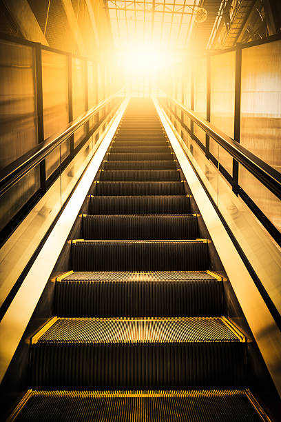 istock Escalators stairway as a concept of successful elevation 510149818
