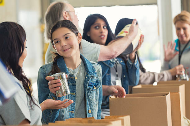 istock Diverse volunteers packing boxes at food drive 510150986