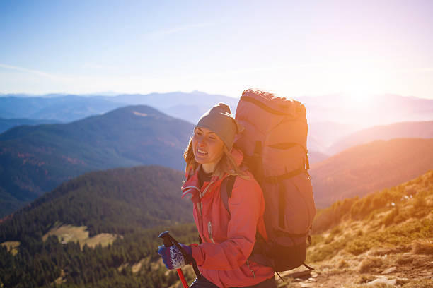istock Girl with a backpack climbs the hill. 510152108