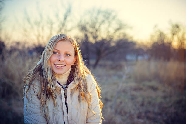 istock Smiling young woman looking at the camera with blue eyes 510152890