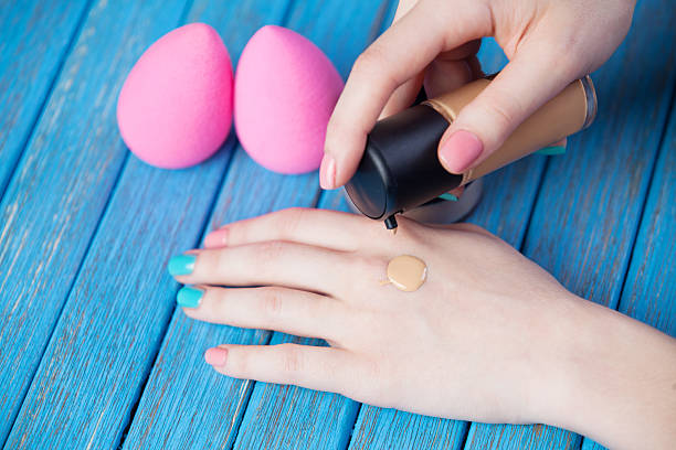 Female hand and beauty blender. stock photo