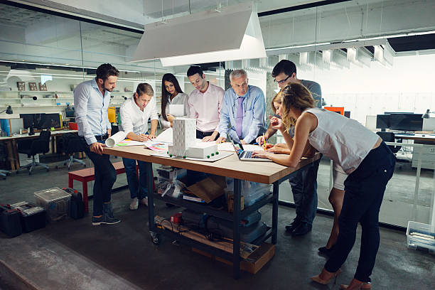 istock Team of architects reviewing architectural model in the office. 510153859