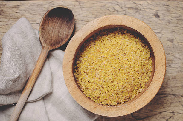 istock Raw Bulgur on wooden background 510154024