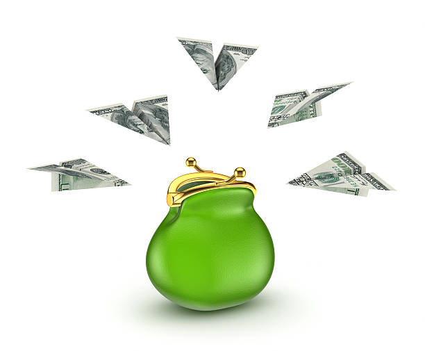 istock Paperplanes made from dollars around green purse. 510154677