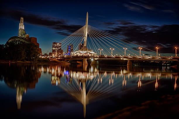 Winnipeg, Manitoba A shot of Winnipeg along the Red River at the blue hour winnipeg photos stock pictures, royalty-free photos & images