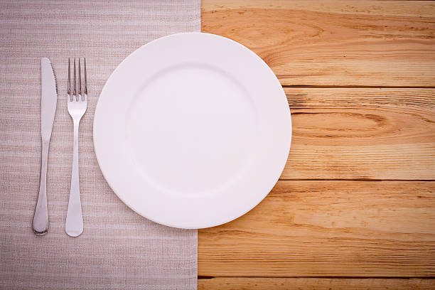 istock Cutlery red checkered tablecloth tartan on  wooden table top view. 510156547