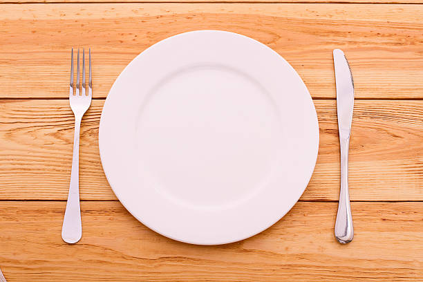 istock Cutlery red checkered tablecloth tartan on  wooden table top view. 510156563