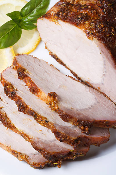istock Tasty baked pork fillet and basil on a plate. vertical 510157171