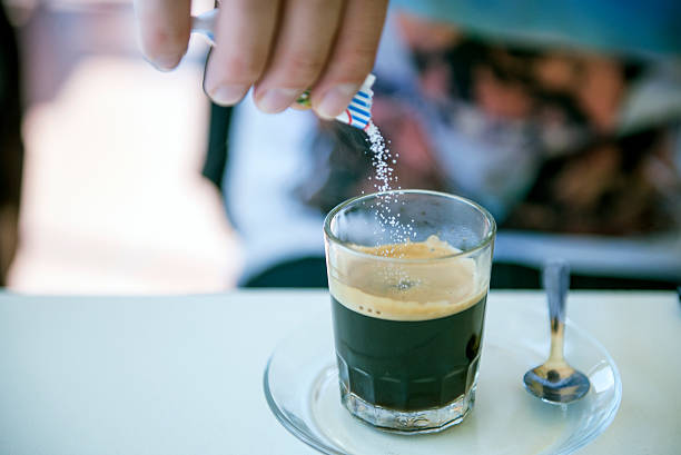 istock Man Pouring Sugar in The Coffee 510157902