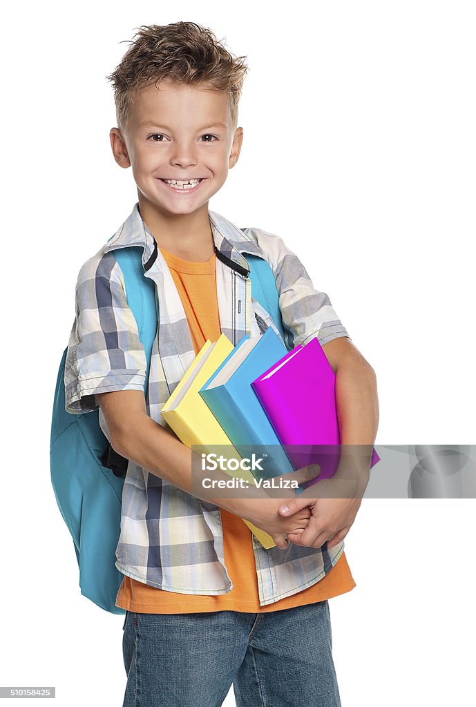 Boy with books Happy schoolboy with backpack and books isolated on white background Adult Stock Photo