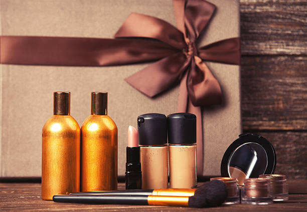 istock Cosmetics and gift box on wooden table. 510159113