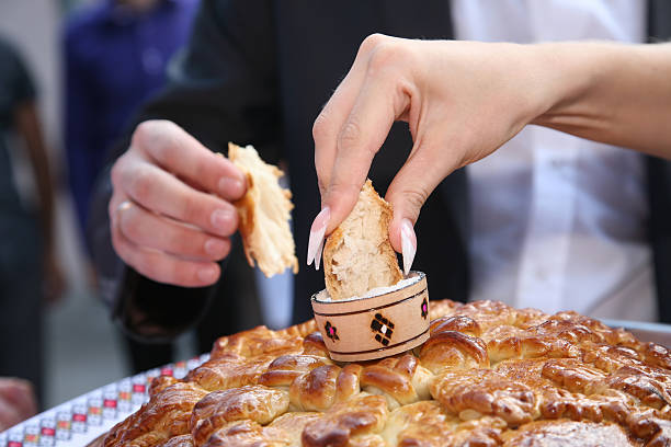 bride and groom salt broken piece of wedding loaf