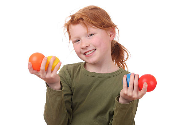 Girl holding balls