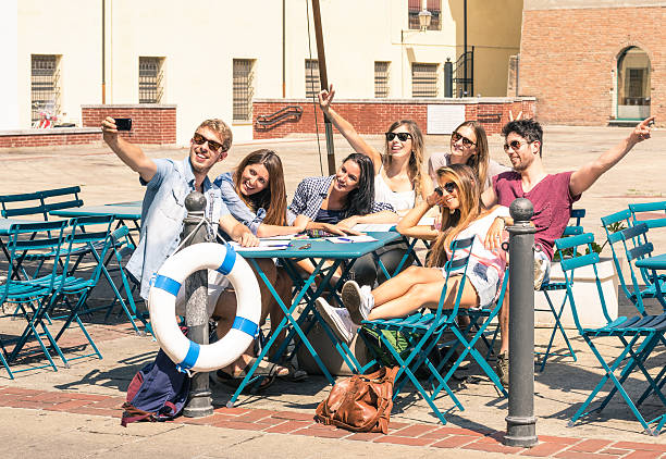 Group of happy students best friends taking a selfie