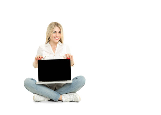 istock Young blonde woman showing blank laptop computer screen sitting 510161260