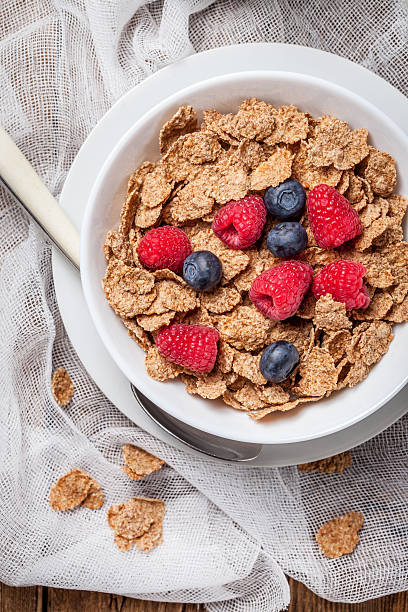 istock Bowl of cereals with blueberries and raspberrie. 510164868
