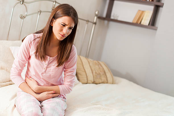 istock Woman with a stomach ache 510165796