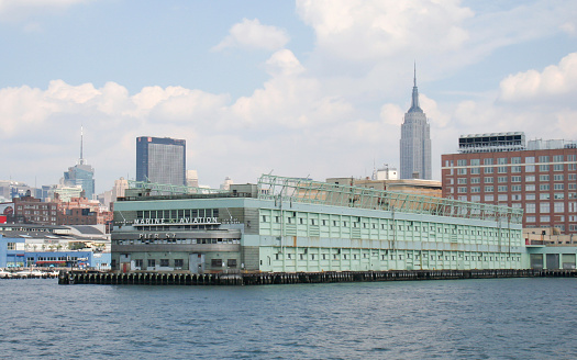 New York, United States - August 21, 2005: A view of the New York City Marine and Aviation Pier with the Empire State Building in the Background