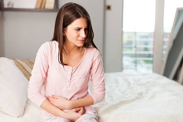 istock Woman with a stomach ache 510166356