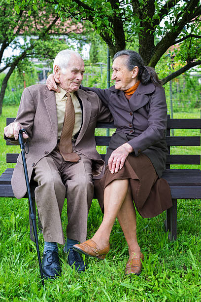 istock Cute 80 plus year old married couple in their garden 510167976