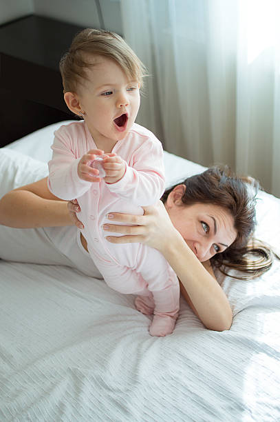 istock Blue eye innocent with her momy on bed 510174370