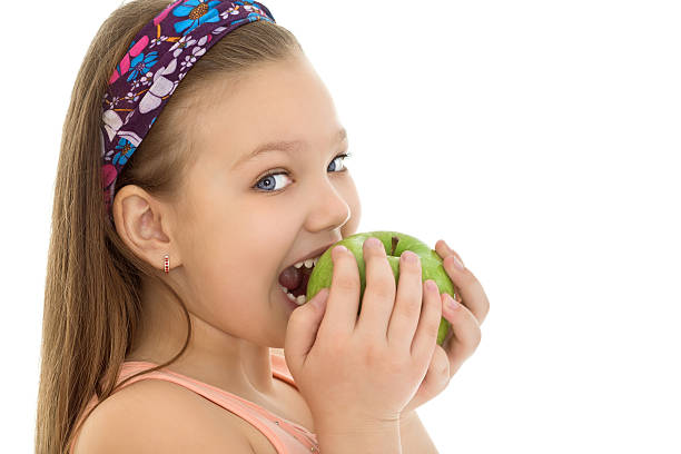 istock The girl bites the Apple 510174674