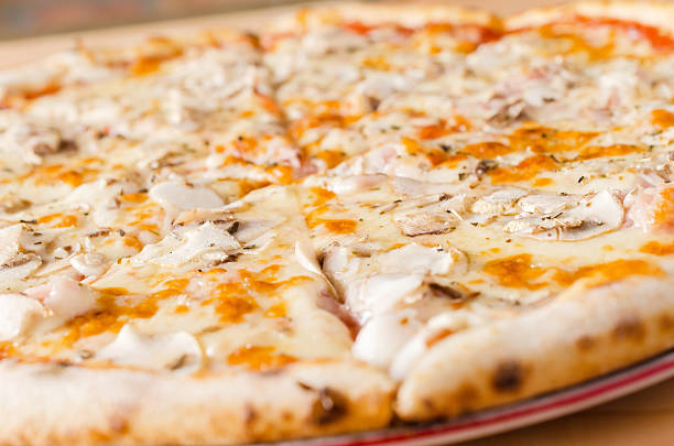 istock Pizza with ketchup, ham, mushrooms and melted cheese 510176010