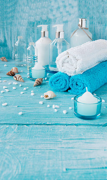 istock White flowers lying on and candle Spa set 510176306