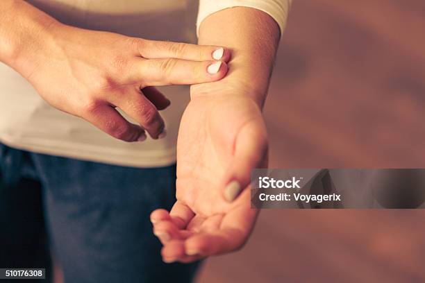 Woman Checking Pulse On Wrist Closeup Stock Photo - Download Image Now - Taking Pulse, Wrist, Frequency