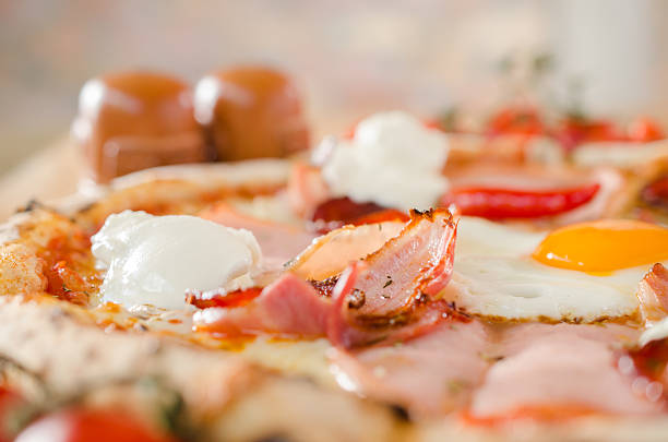istock Pizza with bacon, eggs, sour creme and pepperoni 510176542