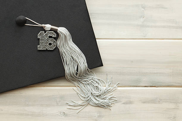 istock Black and Silver Bling 2016 Graduation on White Wood 510177580