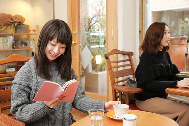 Diverse aged group of people reading books together