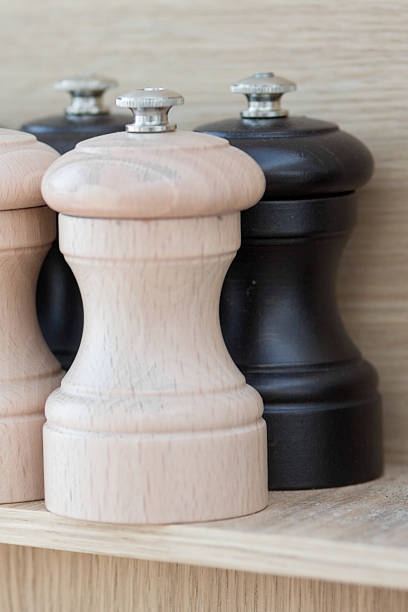 istock Wooden salt and pepper grinders on a shelf 510177688