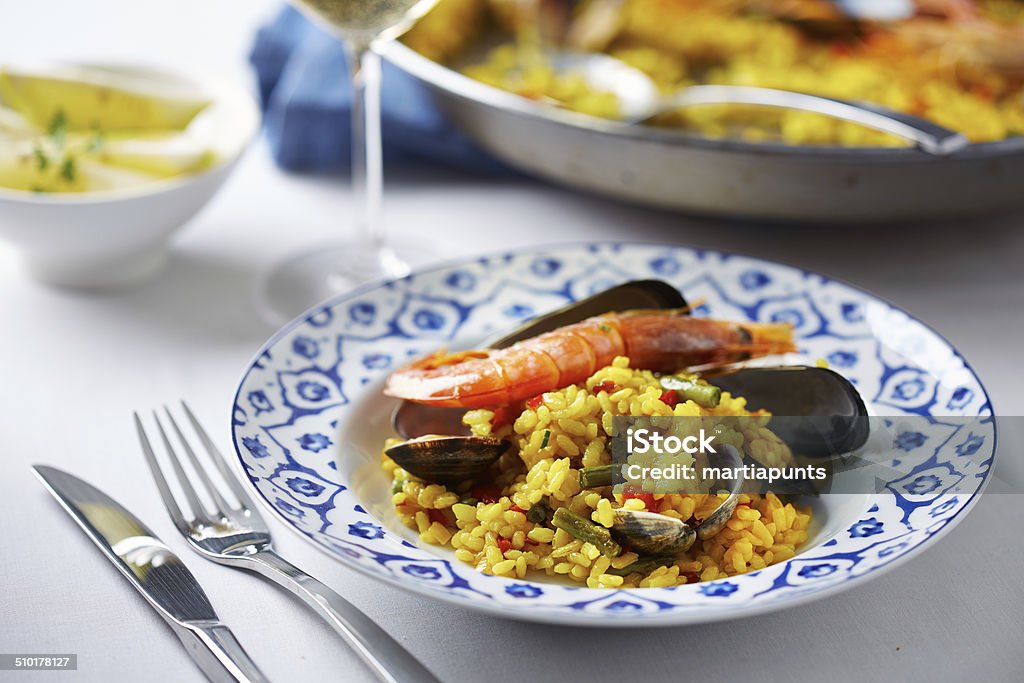 Typical spanish seafood paella Typical spanish seafood paella in a dish Cooked Stock Photo