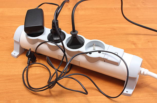 istock Electrical cords connected to power strip, concept of energy saving 510179405