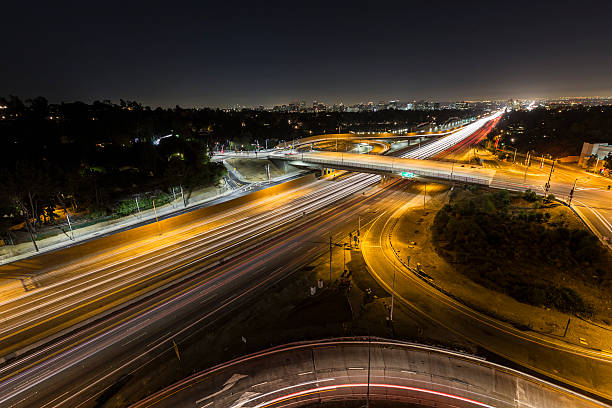 Sunset Blvd at the San Diego Freeway Night Sunset Blvd ramps and the San Diego 405 freeway at night in Los Angeles, California. san diego freeway stock pictures, royalty-free photos & images