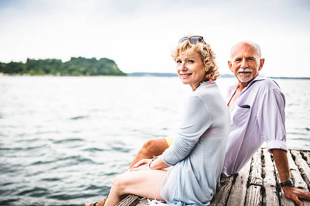 istock couple sitting on the jetty 510180625