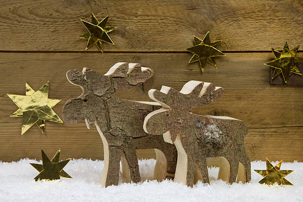 istock Two wooden handmade reindeer with christmas decoration. 510181809