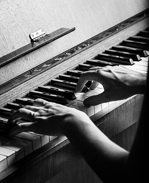 istock Woman playing an old piano 510183707