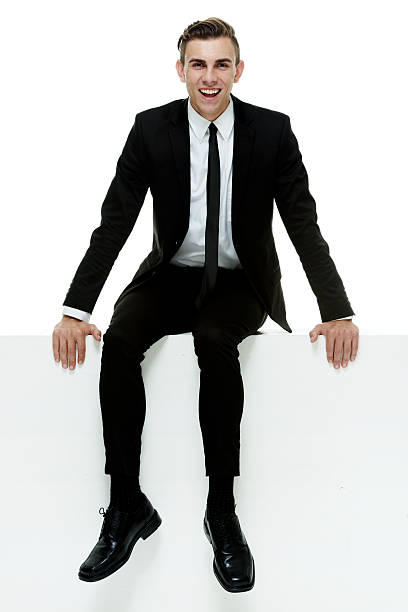 istock Businessman sitting on wall 510184187