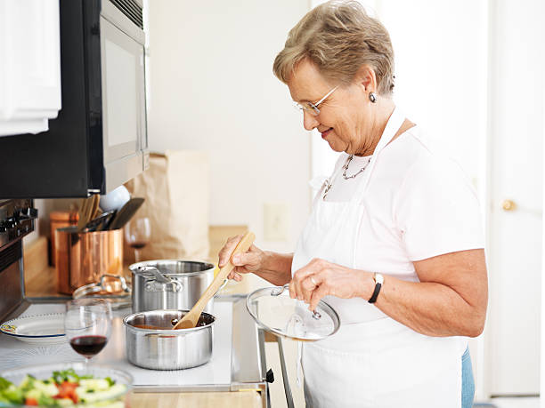 istock grandmother cooking in the kitchen 510185445