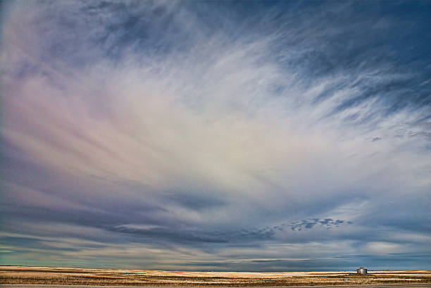 istock Coloured clouds over prairie landscape 510198879