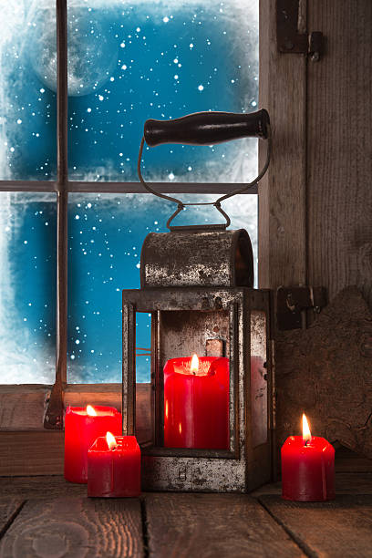 istock Christmas atmosphere: four red burning candles in the window. 510199959