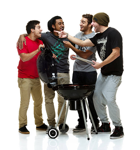 istock Social group of young men having a BBQ 510202265